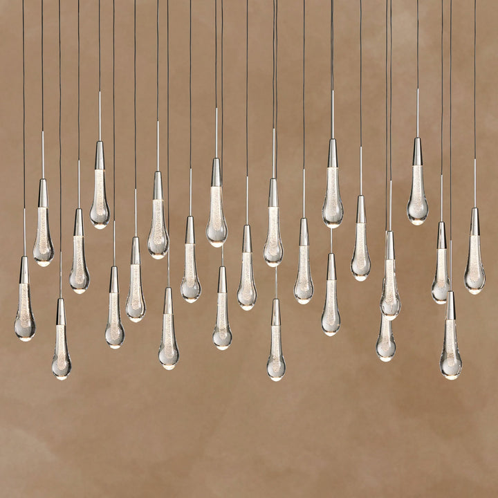 Chandelier with multiple hanging lampshades on a brown background